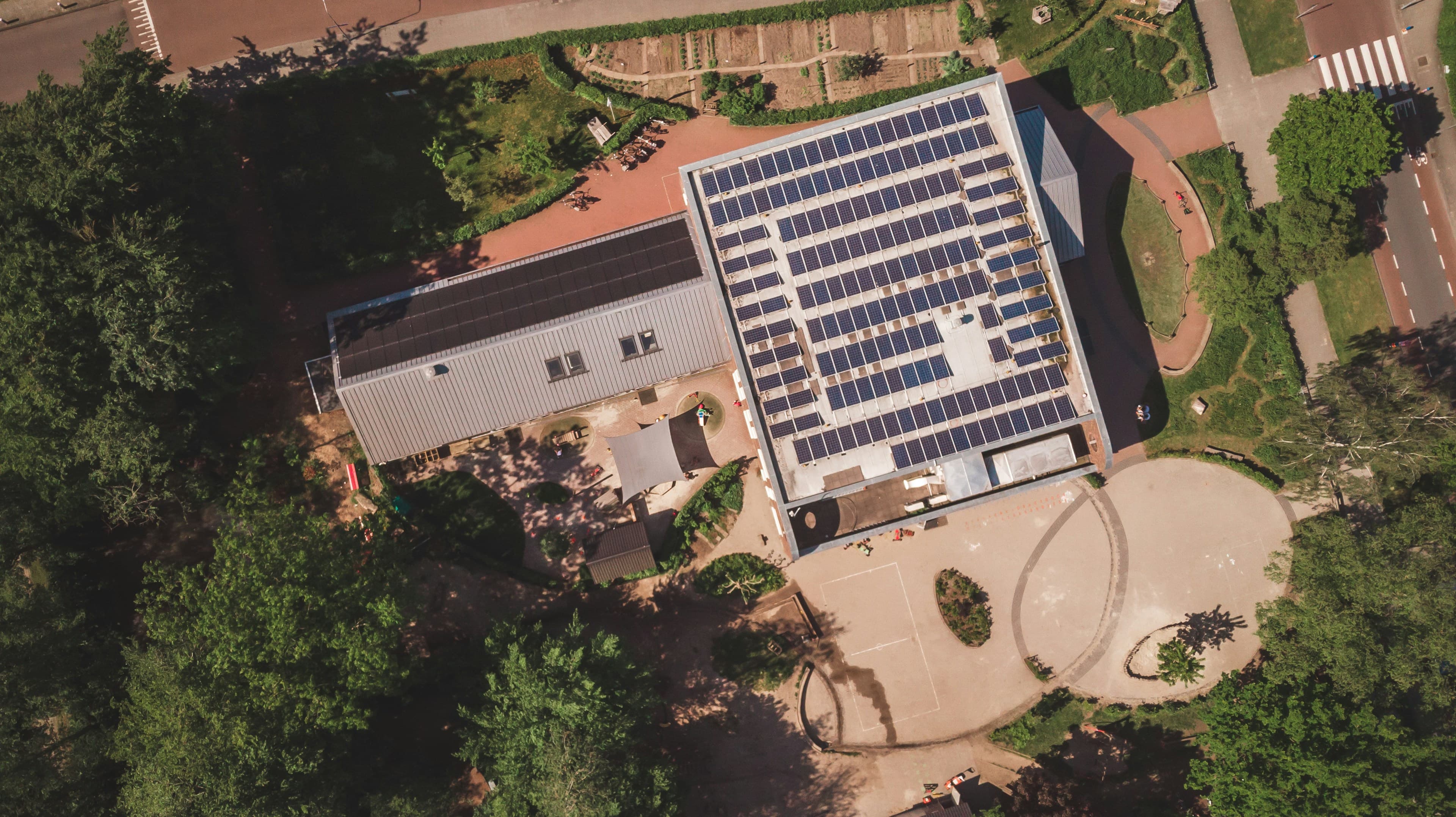 Aerial view of commercial rooftop solar installation